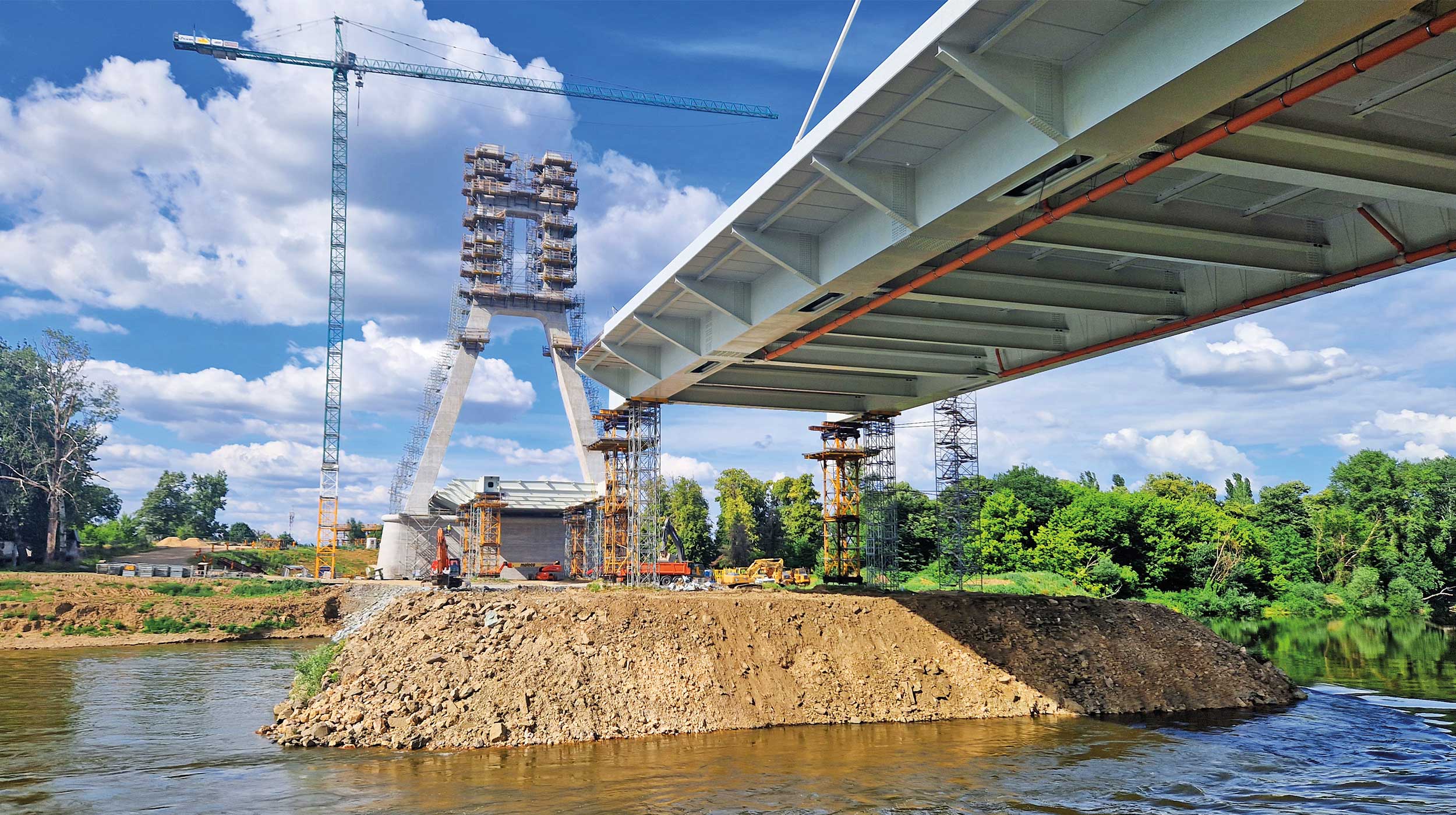 This 644 m cable-stayed bridge, is the third bridge over the Someş River in the municipality of Satu Mare. It is the largest infrastructure project of the municipality of Satu Mare in the last 30 years. This 644 m cable-stayed bridge, is the third bridge over the Someş River in the municipality of Satu Mare. It is the largest infrastructure project of the municipality of Satu Mare in the last 30 years.